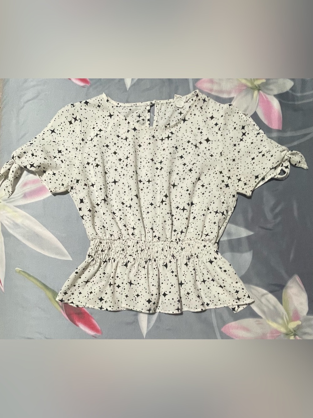 Star-Print Peplum Blouse in White with Black Stars